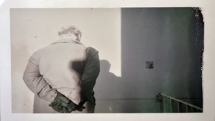 Polaroid, portrait of a male person. 